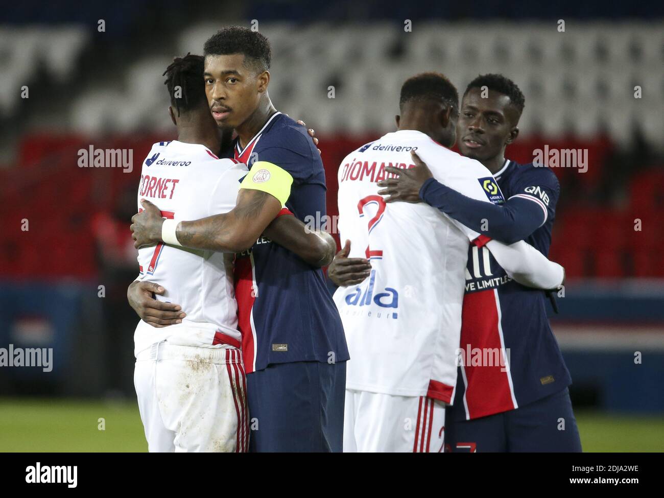 Presnel Kimpembe of PSG hugging Maxwel Cornet of Lyon, Idrissa Gueye Gana of PSG with Sinaly Diomande of Lyon following the Fren / LM Stock Photo