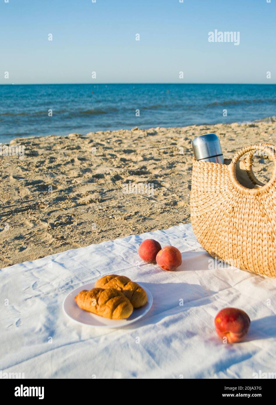 Summer picnic on the beach by the sea at a sunrise Stock Photo Alamy
