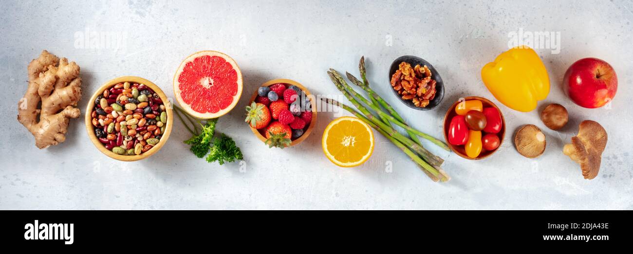 Vegan food panorama. Superfoods, shot from the top. Healthy organic ingredients of a balanced