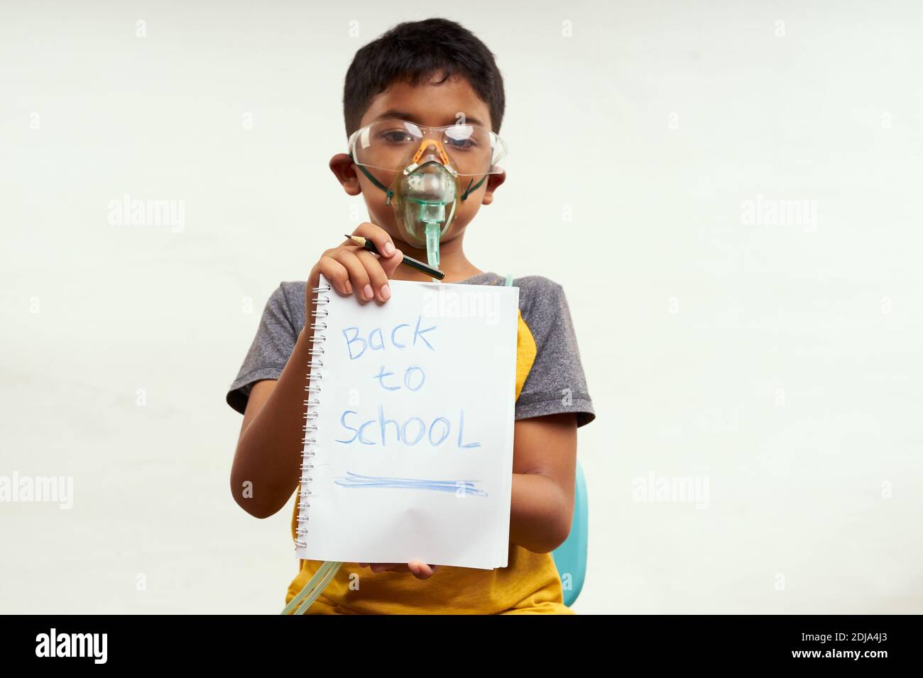 Schoolboy just bored of online classes and wanted Back to school. Home Education concepts Stock Photo