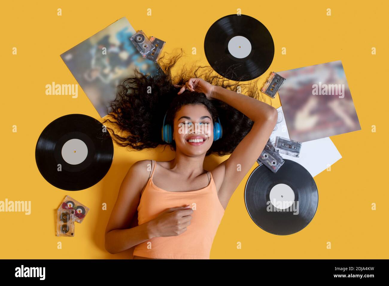 Sweet young girl lying on the floor and listening to music Stock Photo ...