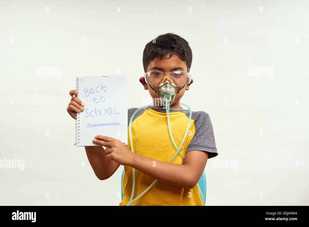 Schoolboy just bored of online classes and wanted Back to school. Home Education concepts Stock Photo