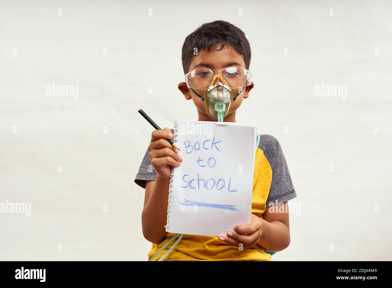 Schoolboy just bored of online classes and wanted Back to school. Home Education concepts Stock Photo