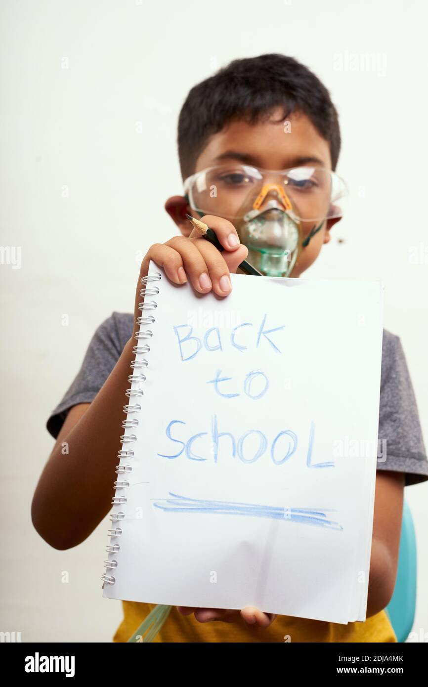 Schoolboy just bored of online classes and wanted Back to school. Home Education concepts Stock Photo