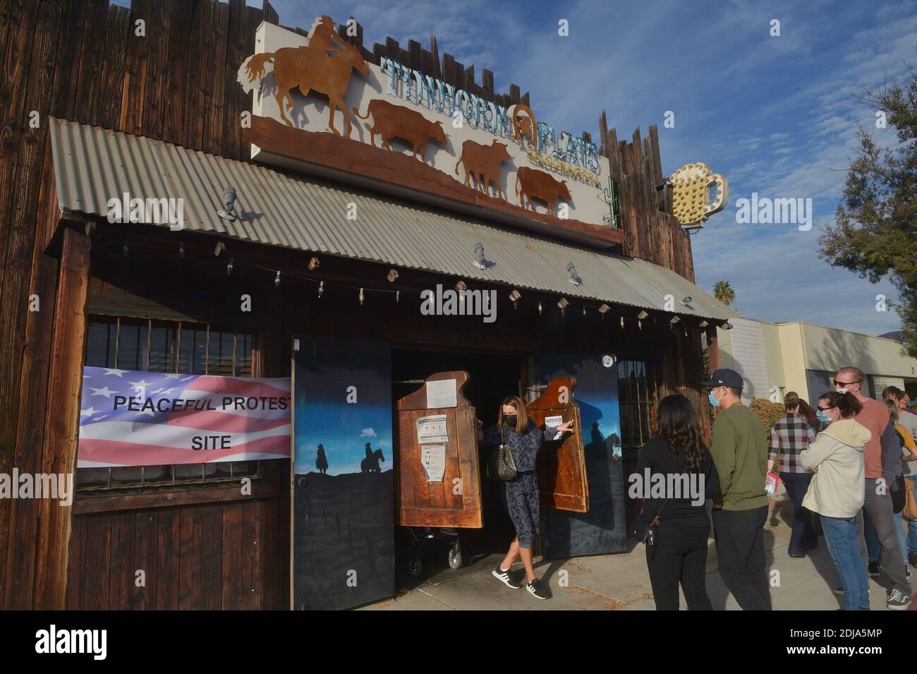 Burbank, United States. 14th Dec, 2020. Patrons gather at the Tinhorn Flats  Saloon and Grill in Burbank, California on Sunday, December 13, 2020. The  popular sports bar is defying Gov. Newsom's order