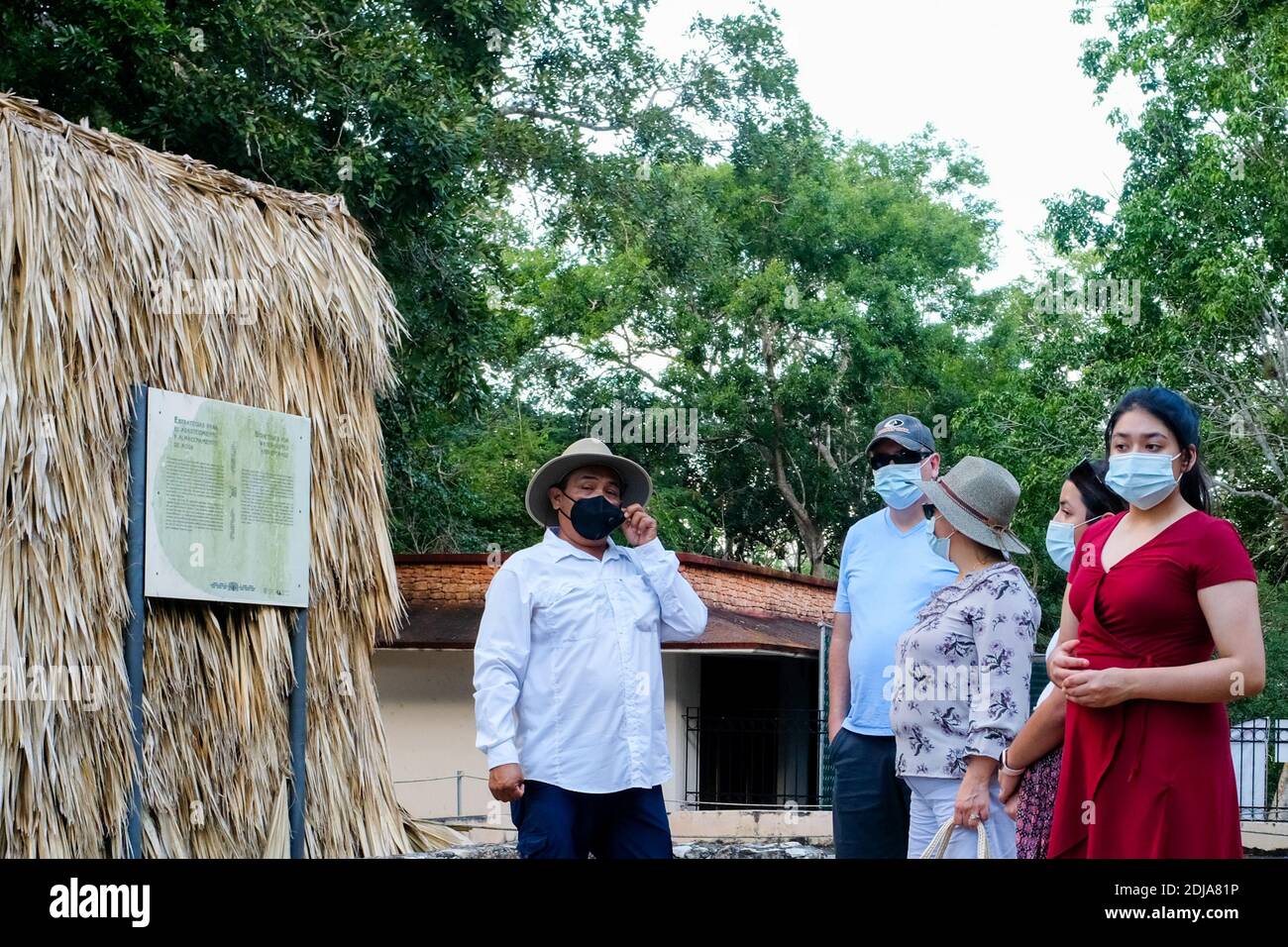 Tourists taking guided tour at the Mayan touristic site of Uxmal in Yucatan Mexico during the Covid-19 Pandemic Stock Photo