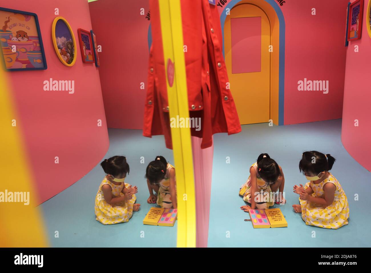 (201214) -- SINGAPORE, Dec. 14, 2020 (Xinhua) -- Two girls play at the otter-themed escapade Otah & Friends at the Gardens by the Bay in Singapore, Dec. 14, 2020. (Photo by Then Chih Wey/Xinhua) Stock Photo