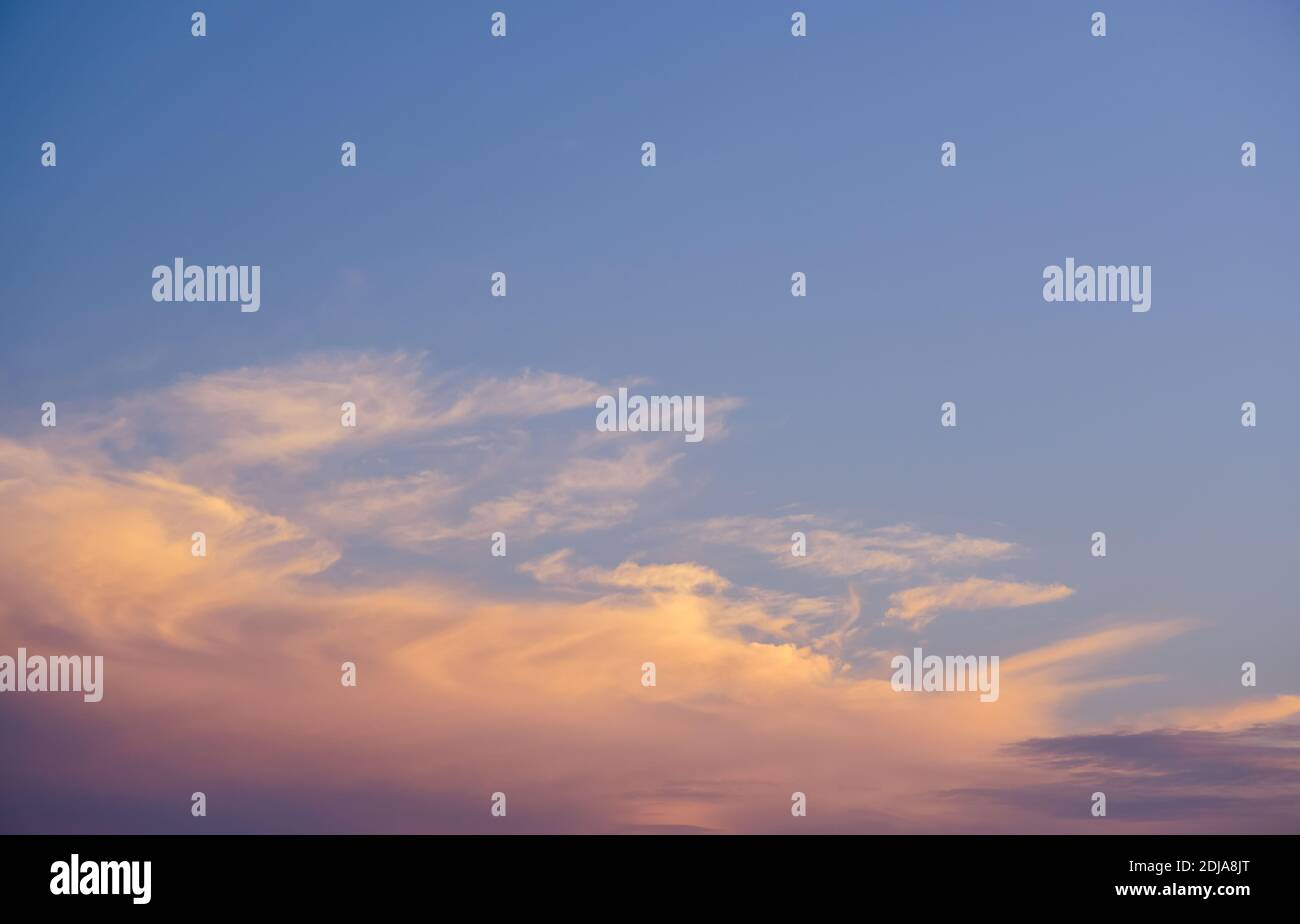 Dramatic sunset sky with colored clouds. Toned image. Stock Photo