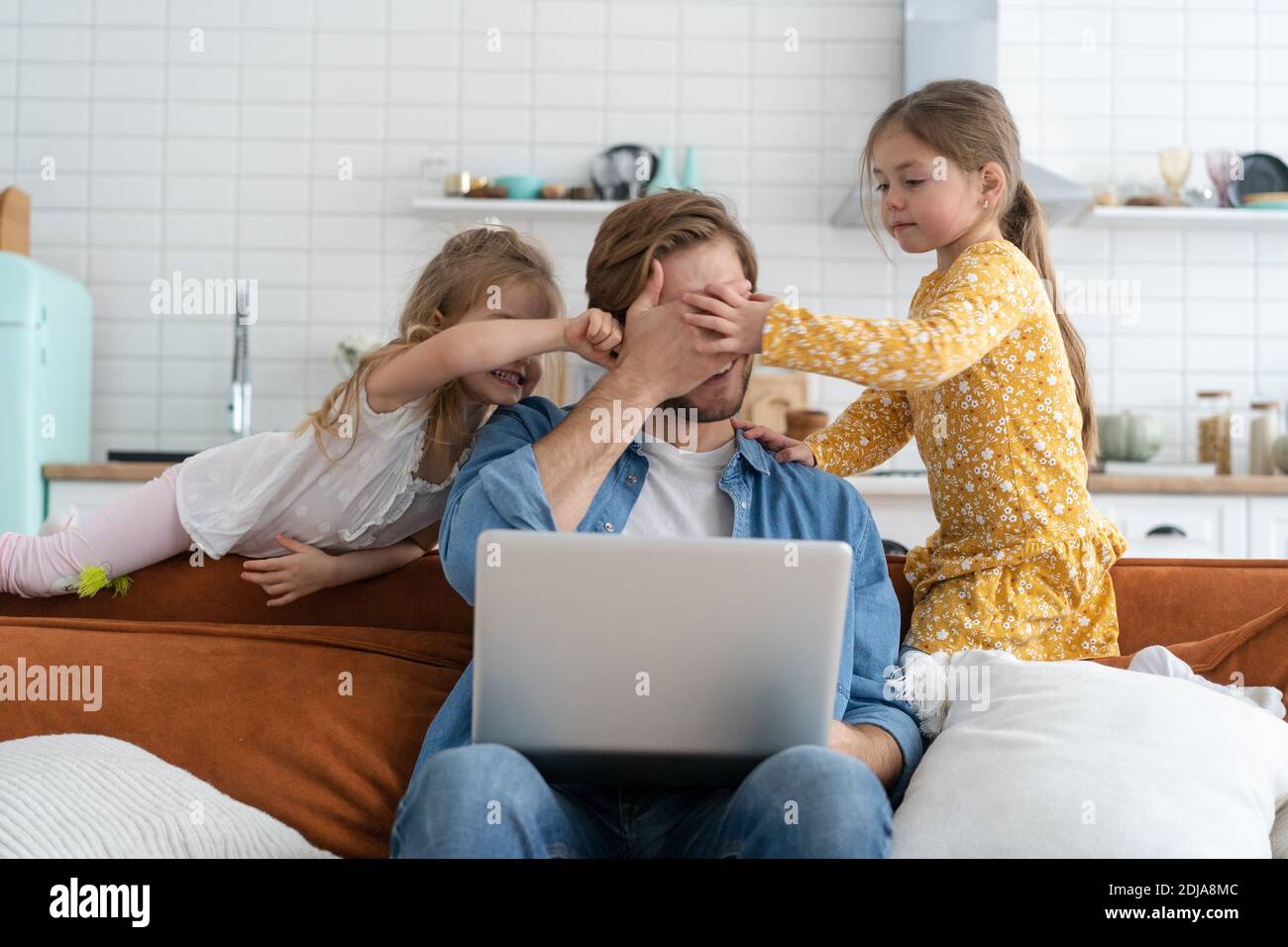 Father working from home with children. Homeschooling, stay home, social distancing during coronavirus quarantine Stock Photo