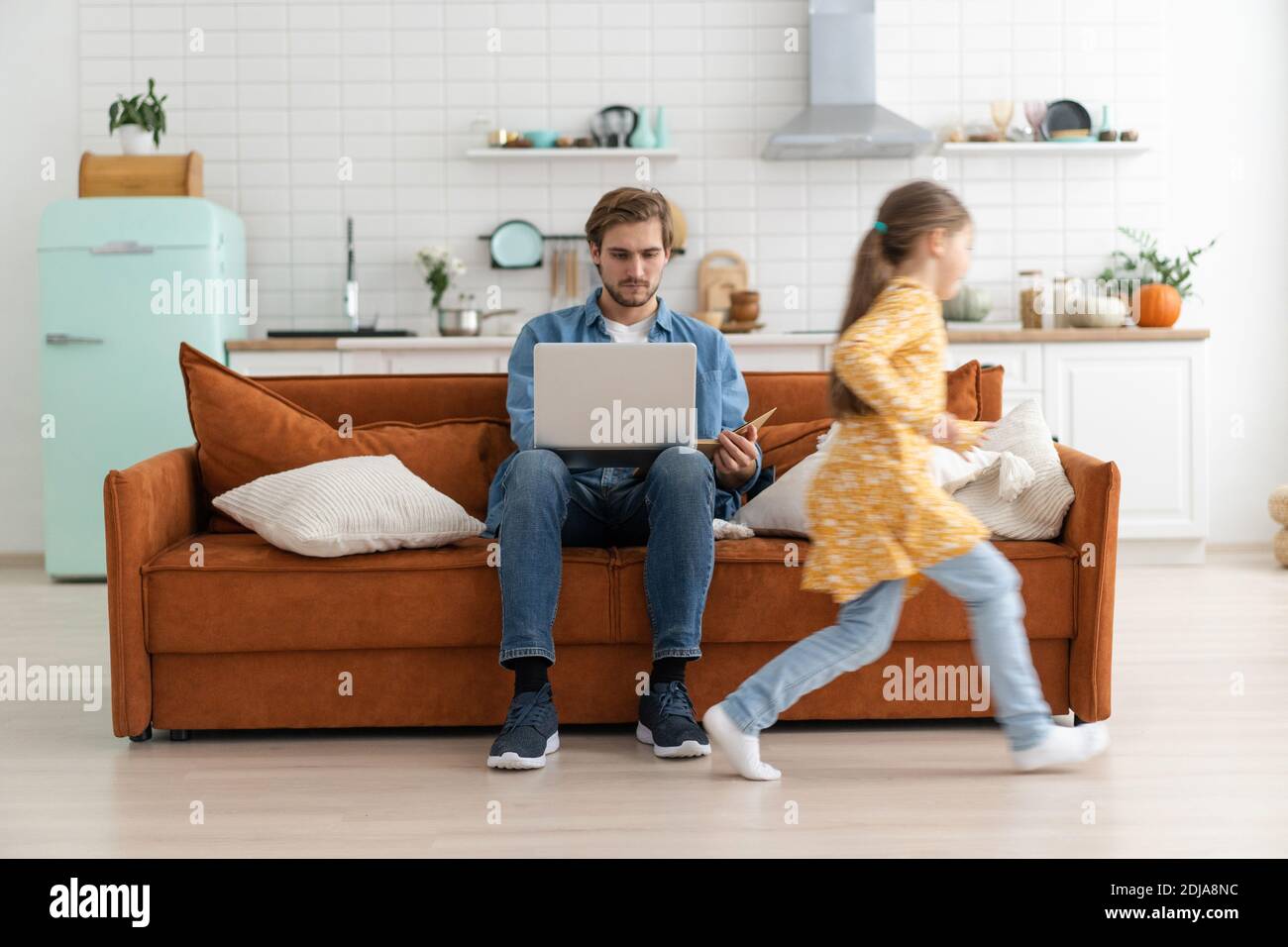 Father working from home with children. Homeschooling, stay home, social distancing during coronavirus quarantine Stock Photo