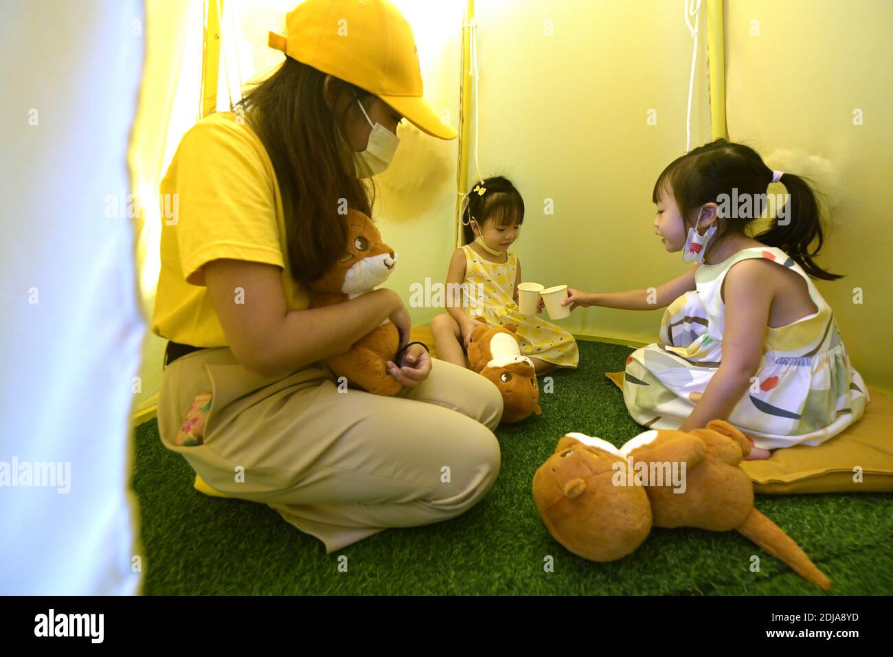 Singapore. 14th Dec, 2020. Two girls spend time at the otter-themed escapade Otah & Friends at the Gardens by the Bay in Singapore, Dec. 14, 2020. Credit: Then Chih Wey/Xinhua/Alamy Live News Stock Photo