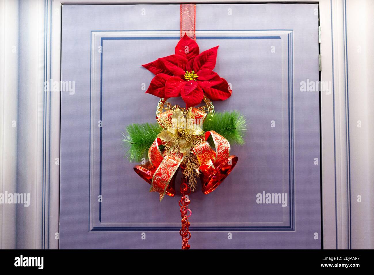Beautiful christmas ornament flower, jingle bell hang at door Stock