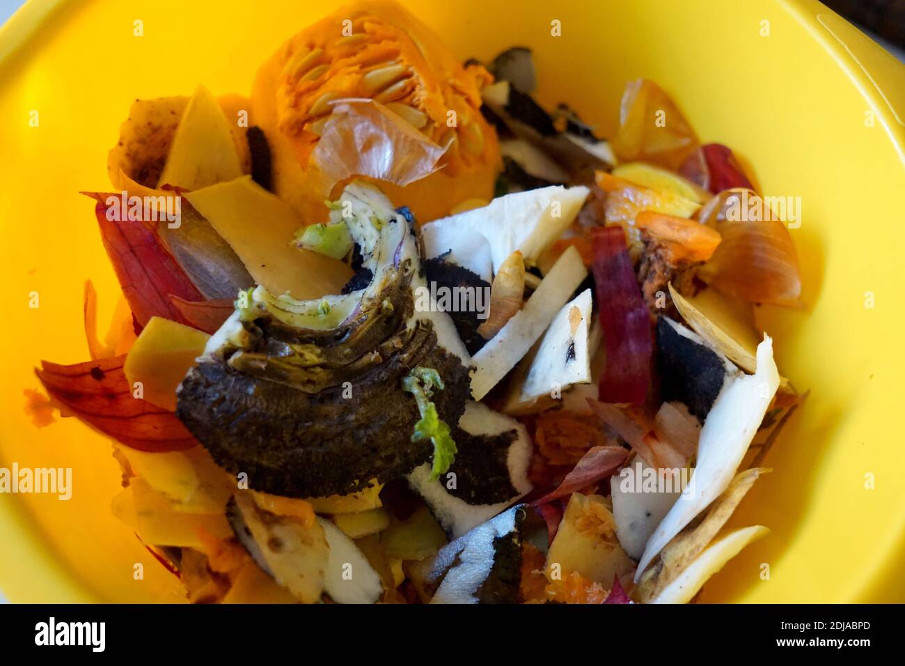 Compost of mix vegetables in yellow container close-up Stock Photo