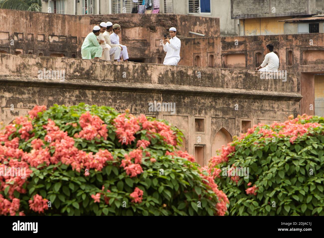 Dhaka, Bangladesh - October 30, 2018: a group of students take a photo on the top of the Lalbagh Fort's walls. Stock Photo