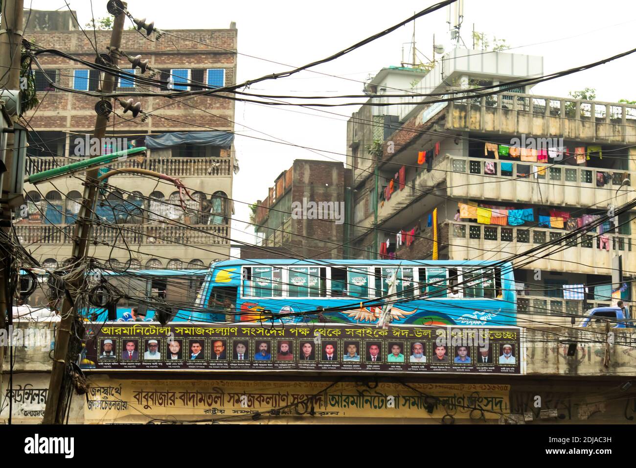 Dhaka, Bangladesh - October 30, 2018: A colourful bus in the traffic of Dhaka. Pollution is a serious problem for the health of the citizens of the ca Stock Photo