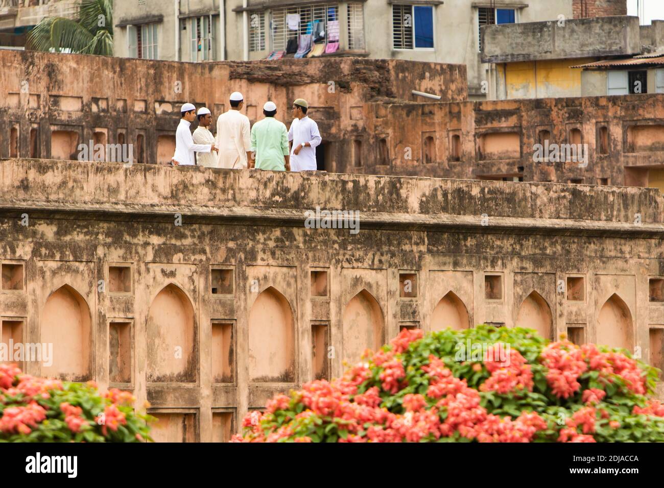 Dhaka, Bangladesh - October 30, 2018: a group of students lie on the top of the Lalbagh Fort's walls Stock Photo