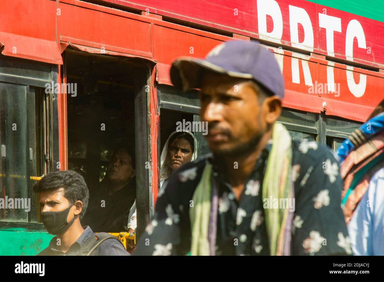 Dhaka, Bangladesh - October 31, 2018: Passenger of a crowdy bus in the traffic of Dhaka Stock Photo