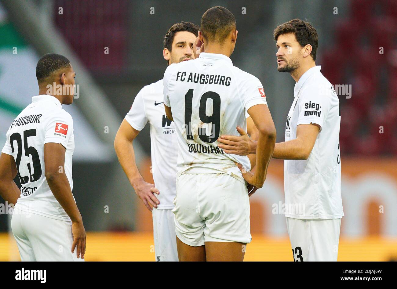 Mark Uth S04 Nr 7 Unconscious And Heavy Head Injury After Crash With Felix Uduokhai Fca 19 Consoled By Fellow Players In The Match Fc Augsburg Fc Schalke 04 2 2 1 German