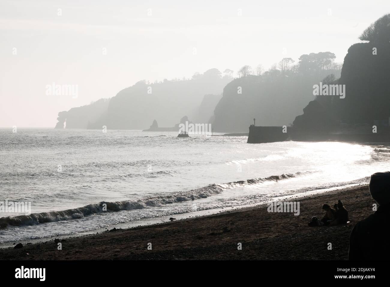 Misty Dawlish coastline towards Holcombe. Black and white, Devon, England, UK Stock Photo