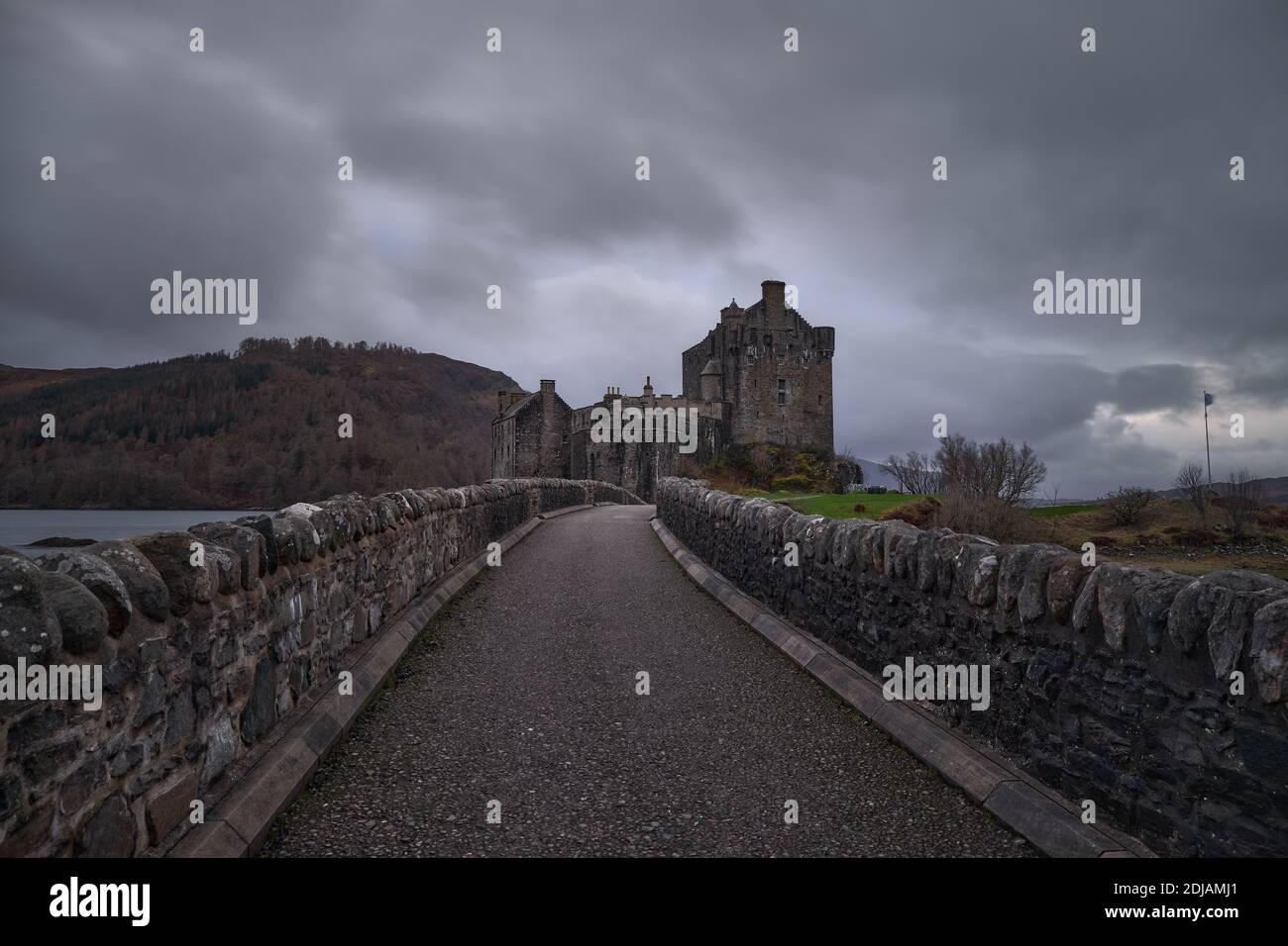 The medieval castle on the Eilean Donan island under the gloomy sky ...