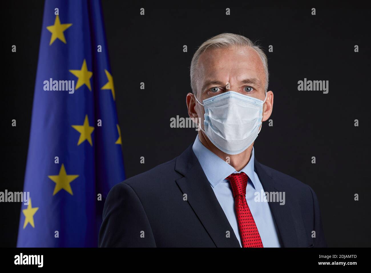 Professional portrait of mature man wearing mask and looking at camera ...