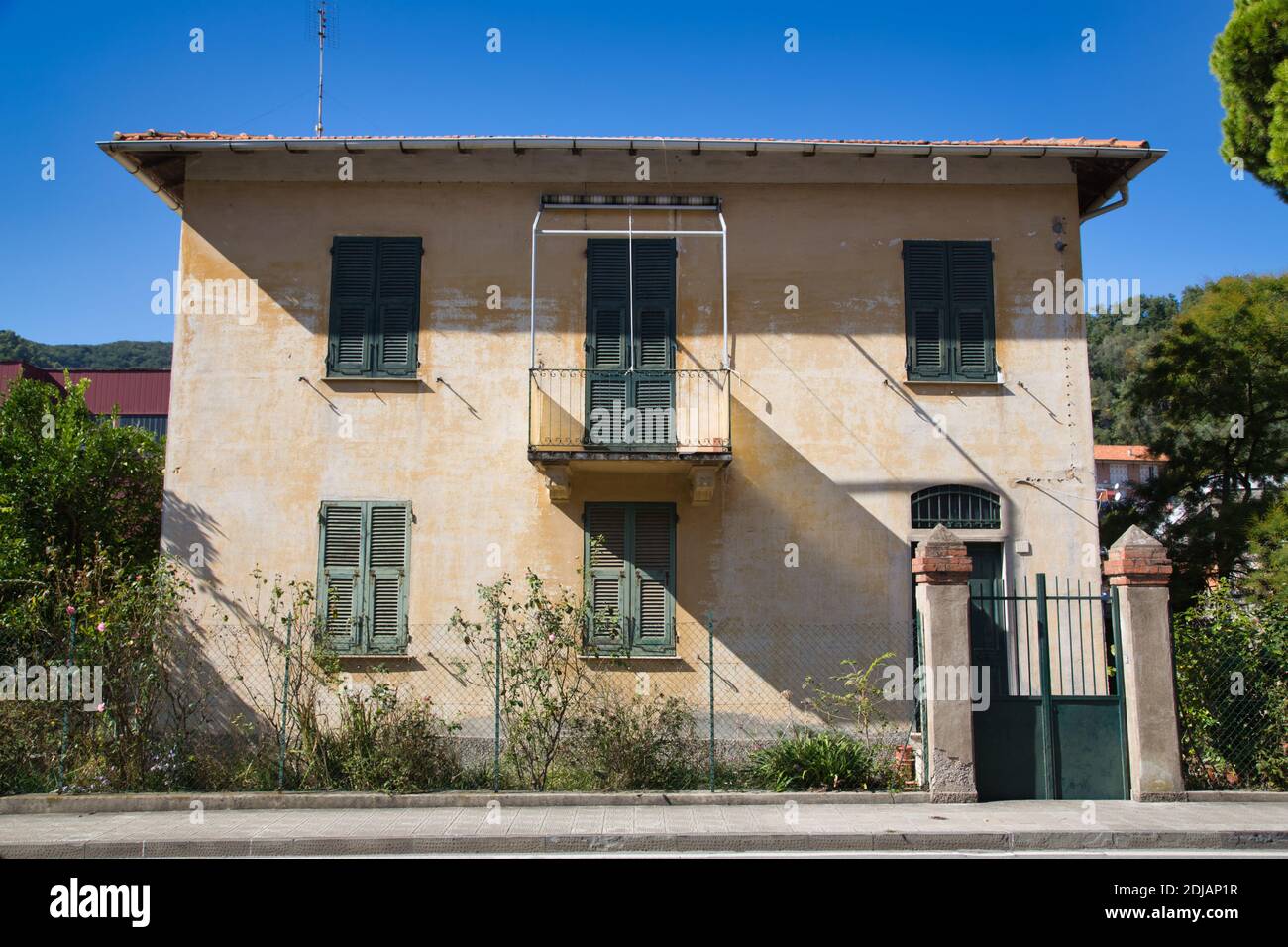 old house with closed blinds Stock Photo