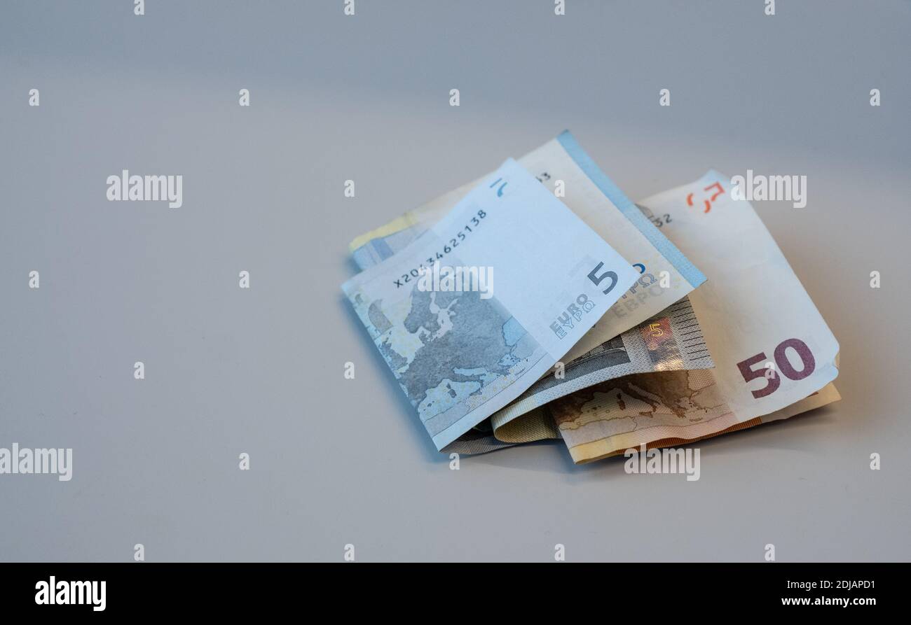 Folded pocket money earnings. Copy space. Stock Photo
