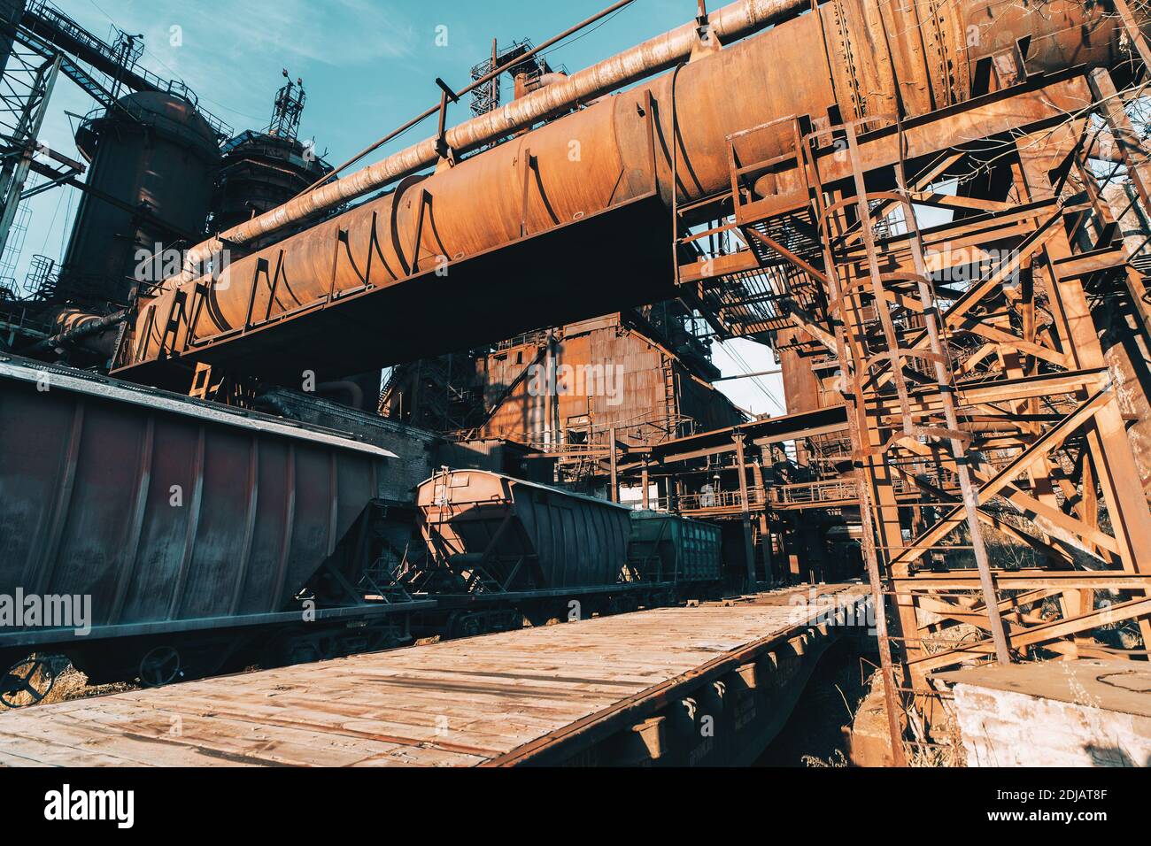Large iron constructions of metallurgical plant and freight wagons infrastructure. Stock Photo
