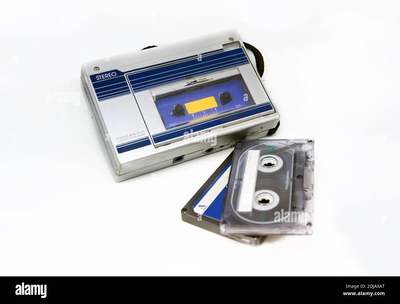 Old portable stereo audio tape cassette player isolated on a white background. Obsolete technology. 80s. Listening to music. Stock Photo