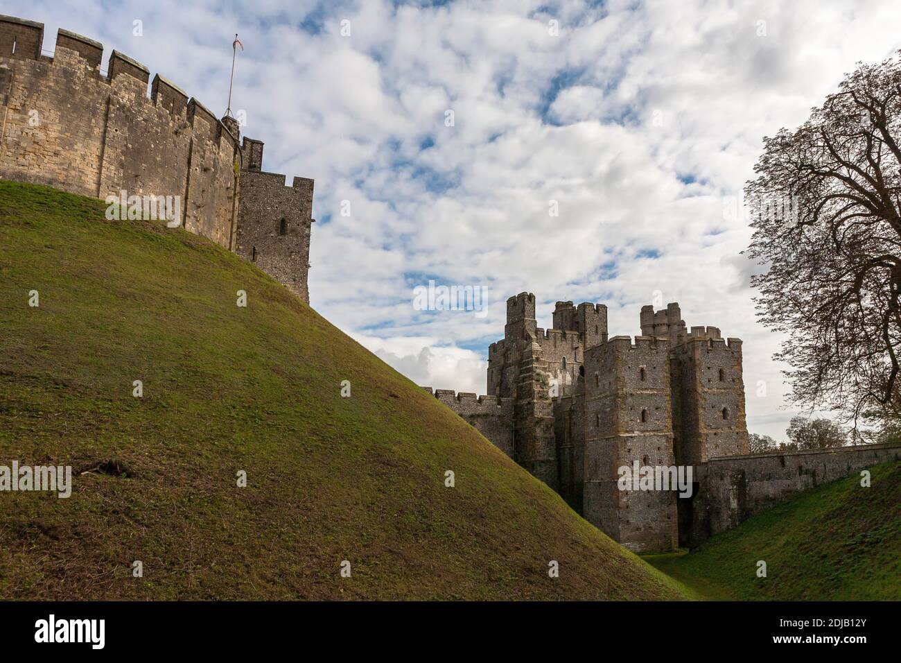 Original Norman motte or mound, surmounted by the 12th century keep, with the 14th century Gatehouse and Barbican beyond, Arundel Castle, West Sussex Stock Photo