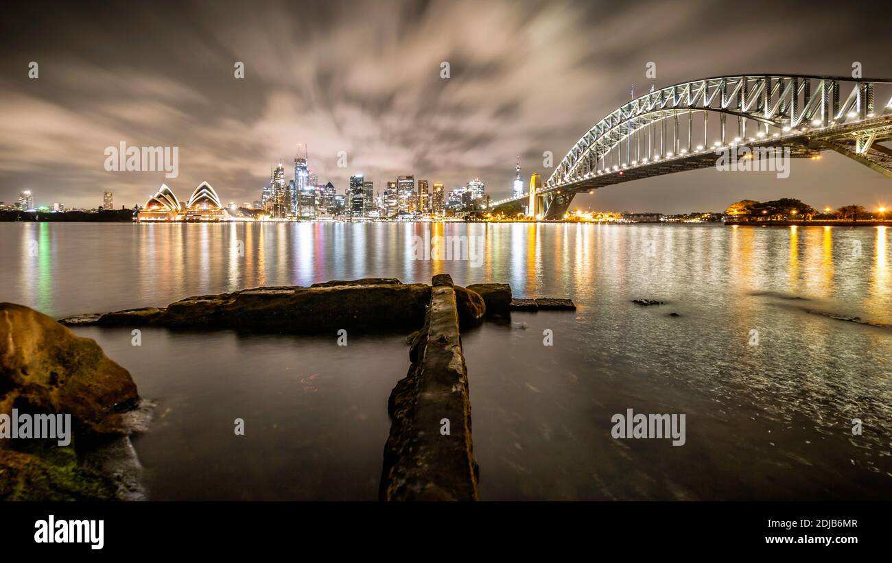 Sydney harbour with harbour bridge and opera house at night Stock Photo