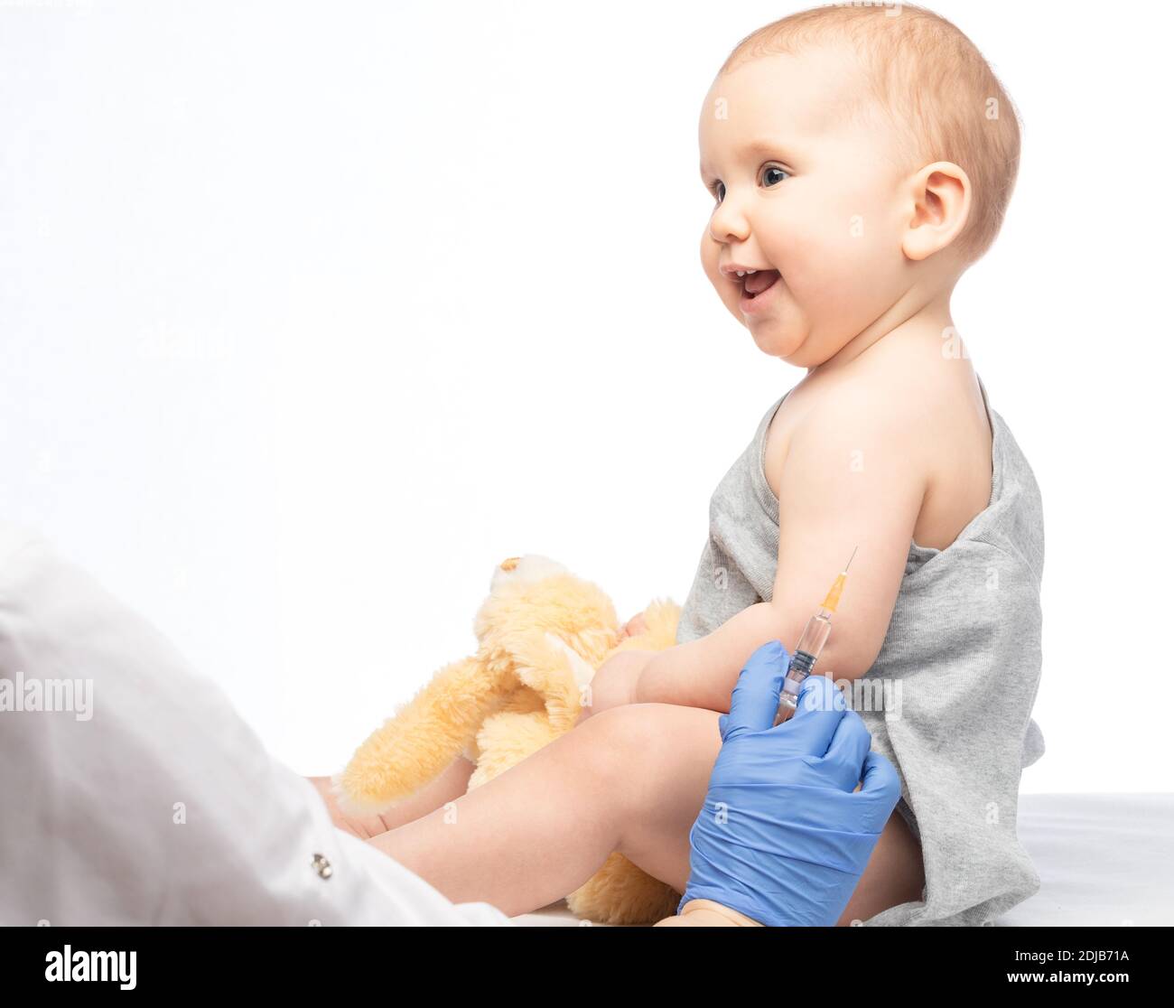 Pediatrician or nurse ready to give an intramuscular injection of a ...