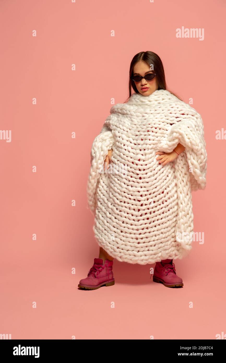 Celebrity. Caucasian female inclusive model posing on studio background in stylish outfit. Realness, tolerance. Her lifestyle is the same like of other people. Concept of wellness, diversity, beauty. Stock Photo