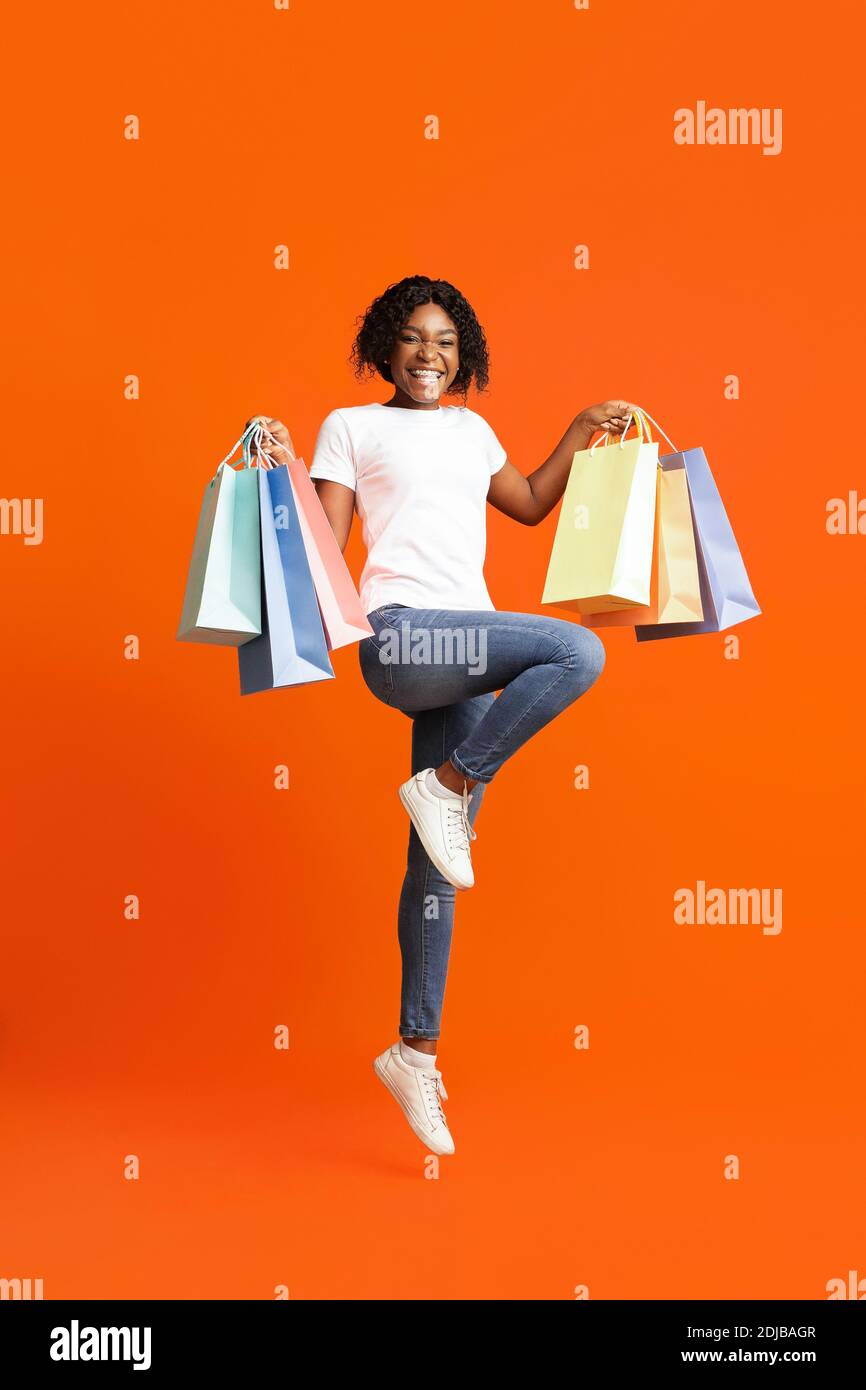 Joyful black lady shopping hi-res stock photography and images - Alamy