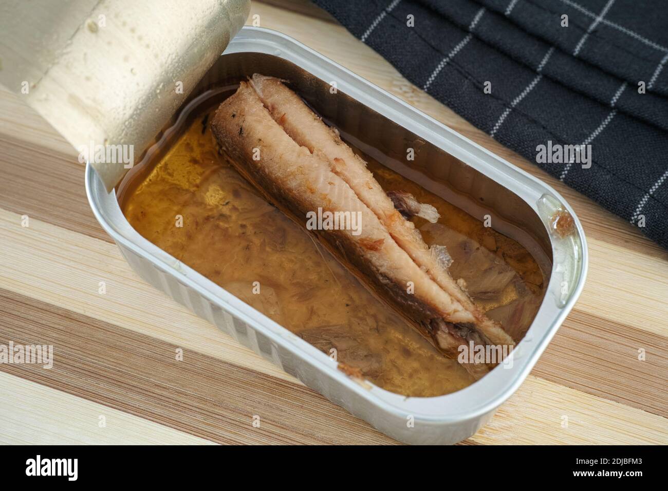 Sardine fillet with olive oil in a open tin can. Close up Stock Photo