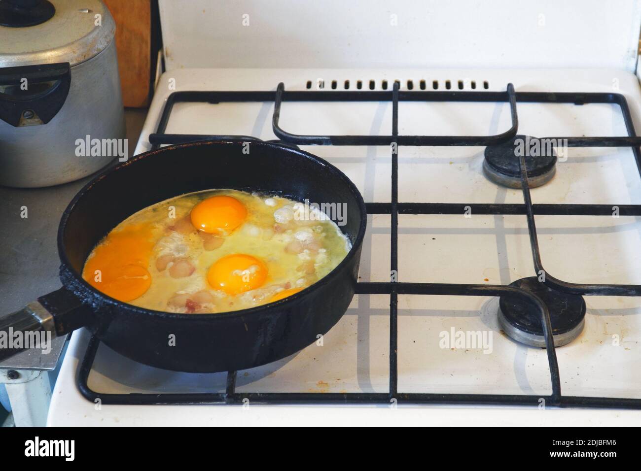 Eggs are fried in a pan. Cooking fried egg Stock Photo