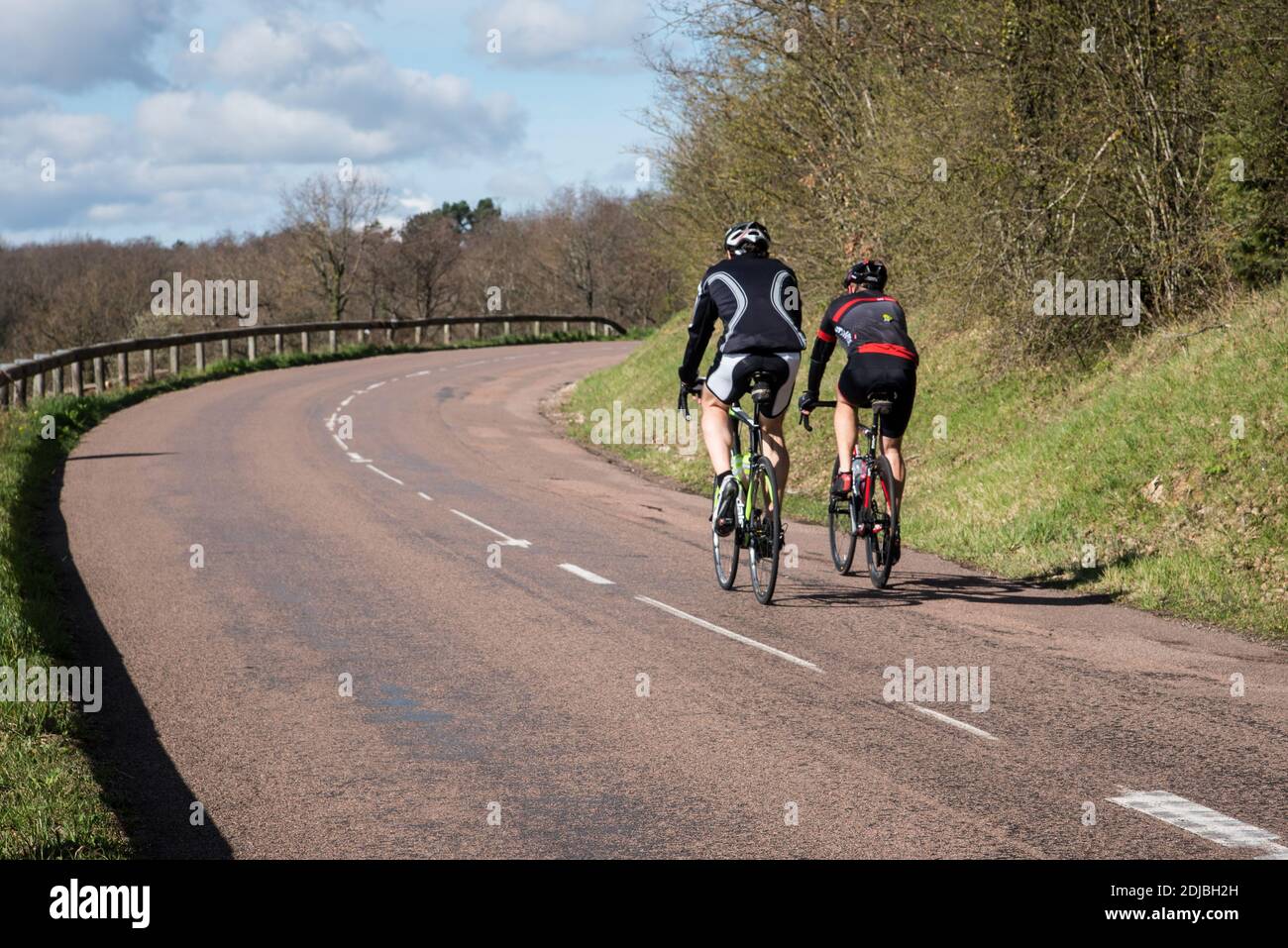 riding on the back of a bicycle