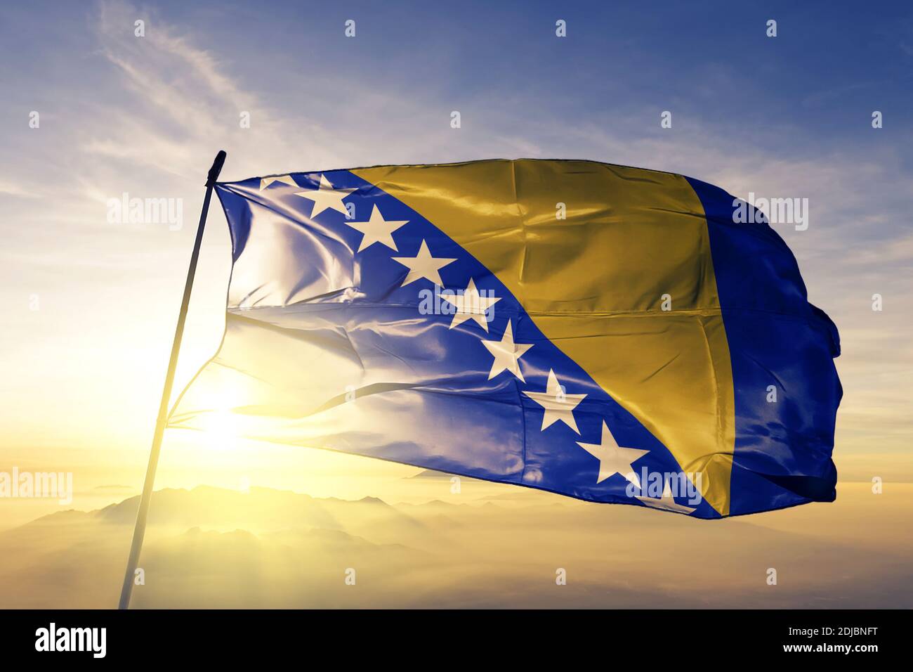 Bosnia and Herzegovina flag waving on the top sunrise mist fog Stock ...