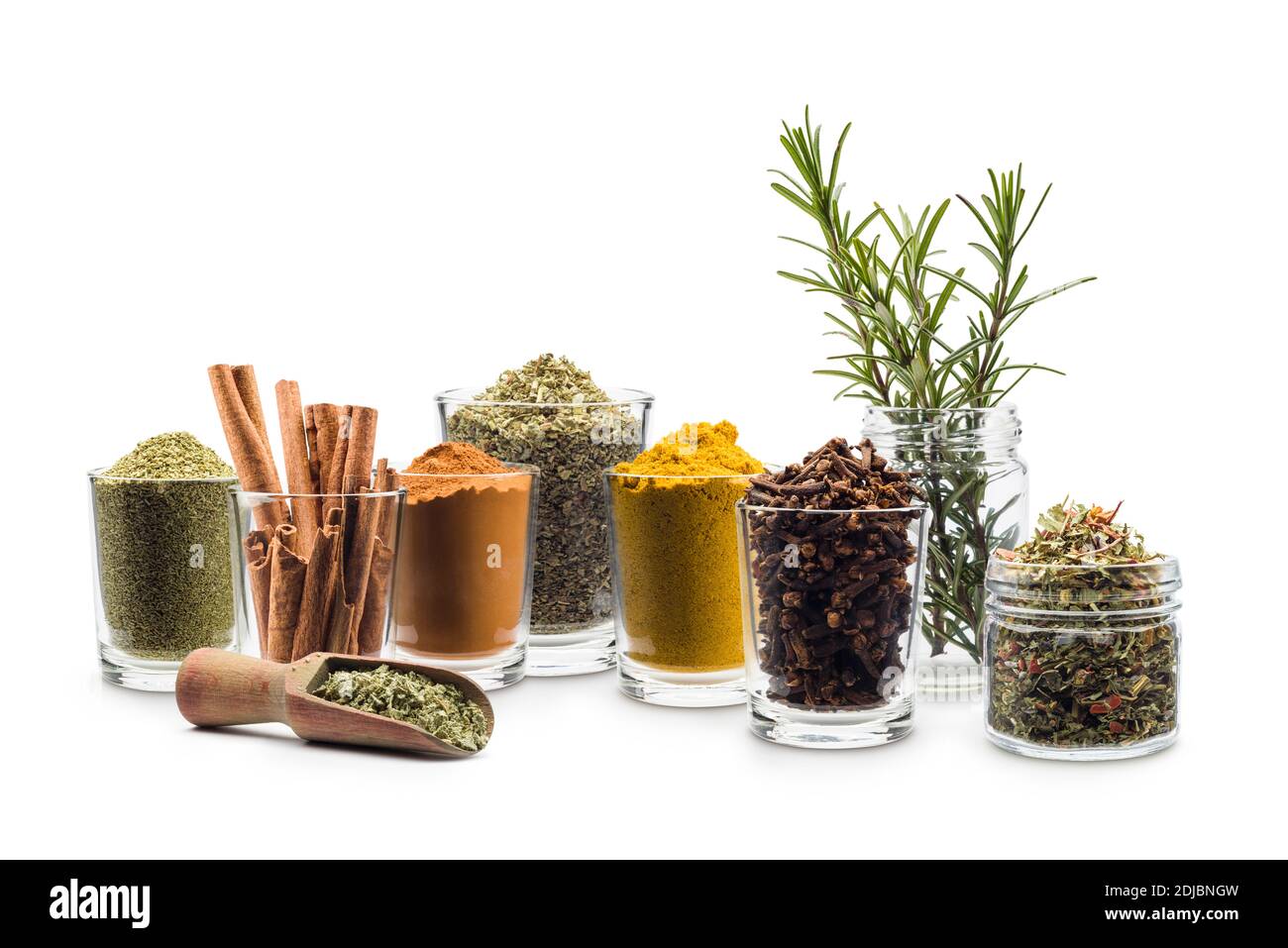 glass jars with various spices on white background Stock Photo