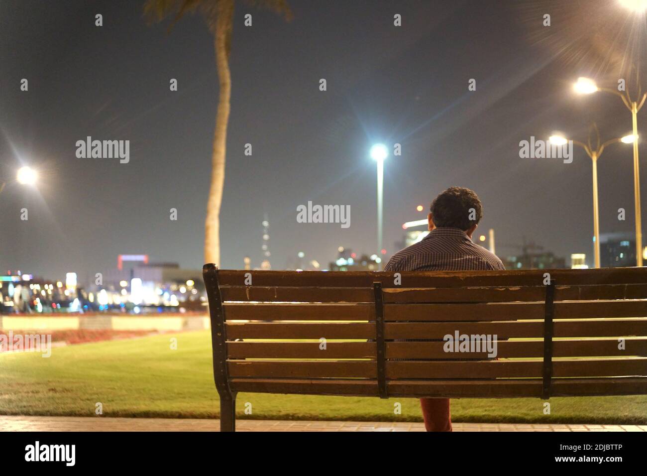 Arab Man Sitting On Park Bench High Resolution Stock Photography and ...