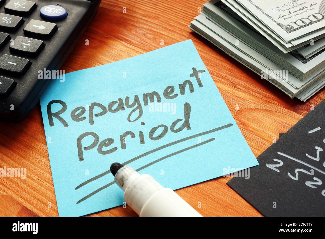 Repayment period memo on the piece of paper. Stock Photo