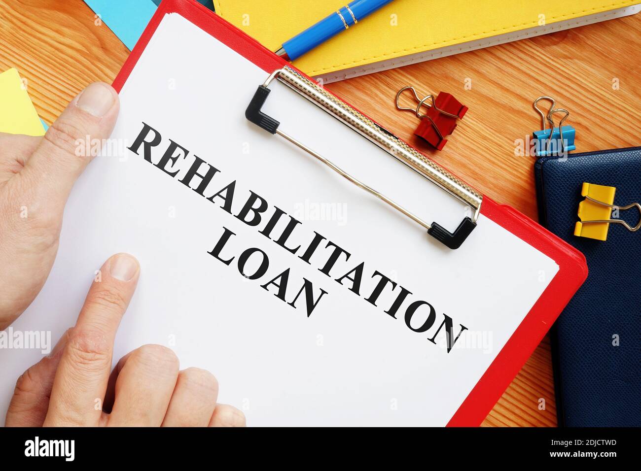 Rehab or Rehabilitation loan application in office. Stock Photo