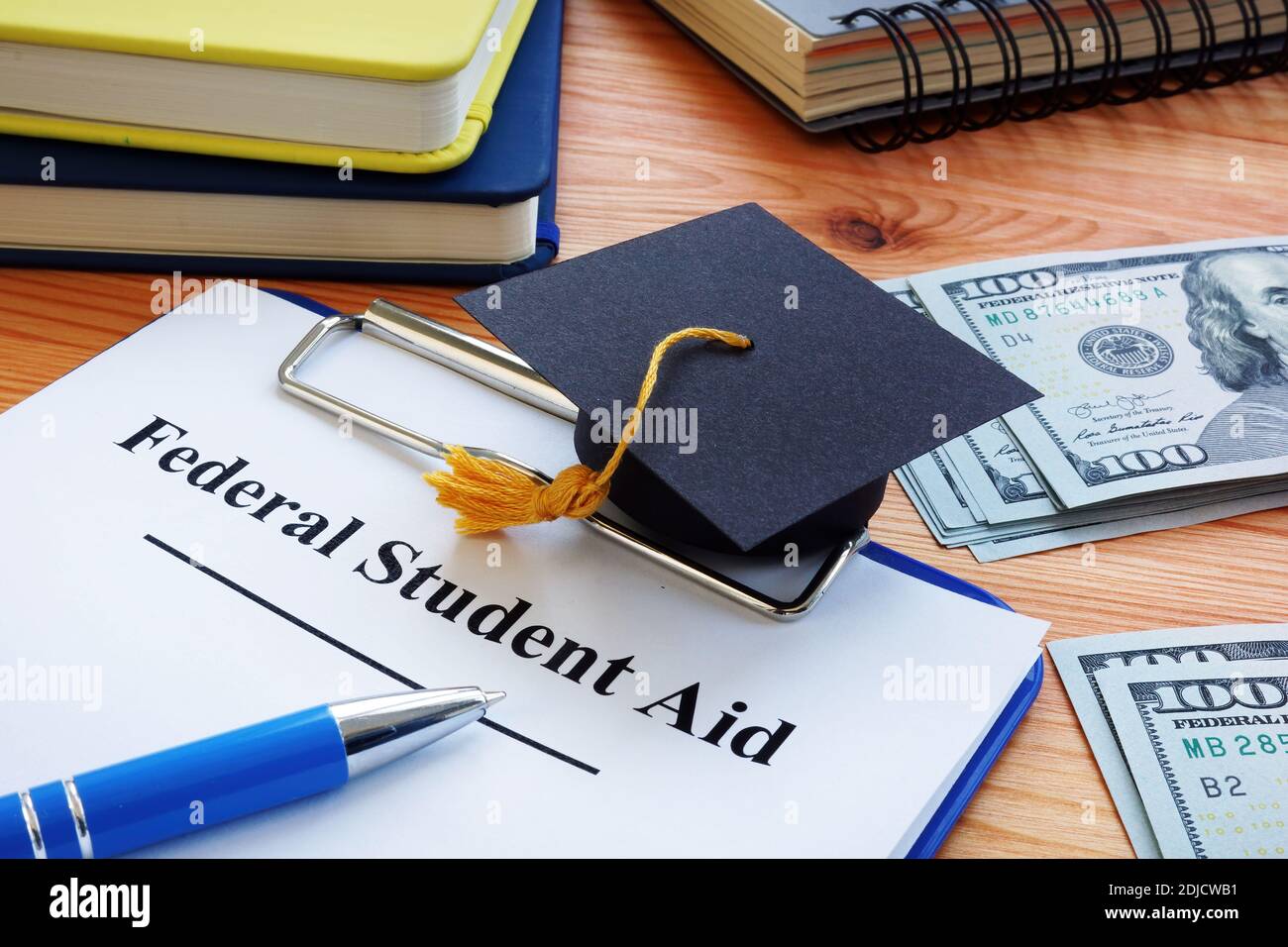 Federal student aid and small Square academic cap. Stock Photo