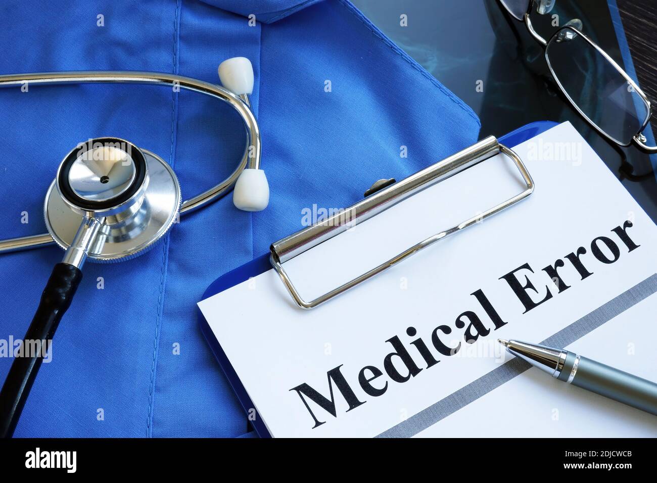 Medical error report with stethoscope and doctor robe. Stock Photo