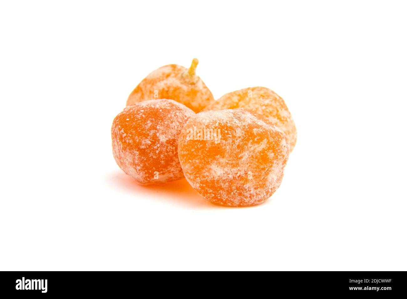 Sugar coated kumquats isolated on white background. Candied fruits, heap of dried kumquats Stock