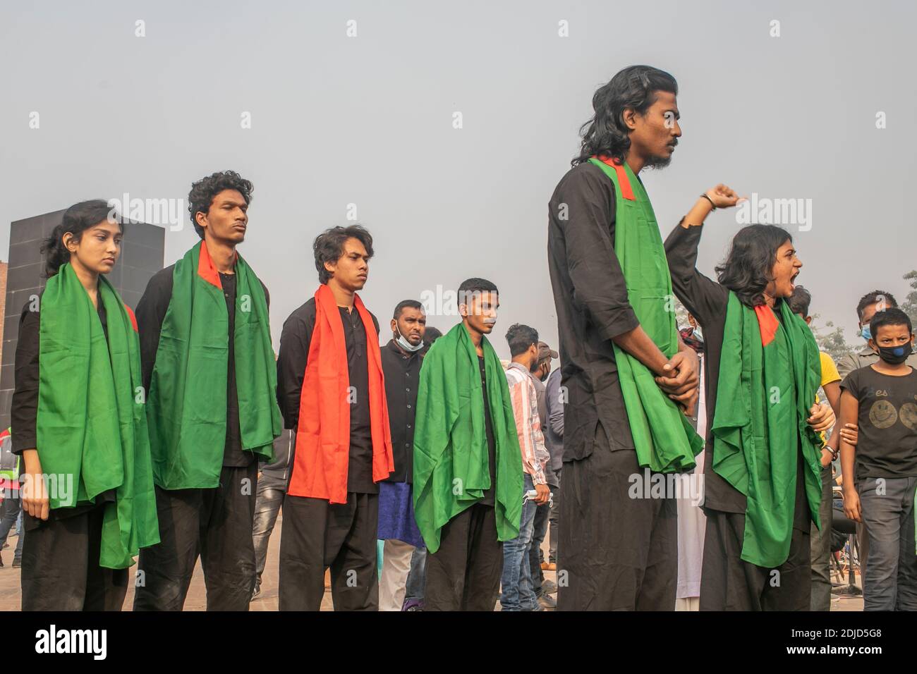 Bangladeshi theatre artists perform during the Martyred Intellectual Memorial in Dhaka.Thousands of Bangladeshis paid tribute to the dozens of intellectuals killed 43 years ago during the war which won the South Asian country independence from Pakistan. The intellectuals were systematically killed across the former East Pakistan by the Pakistani army and their collaborators to maim the emerging nation of its talented and intellectual people. Stock Photo