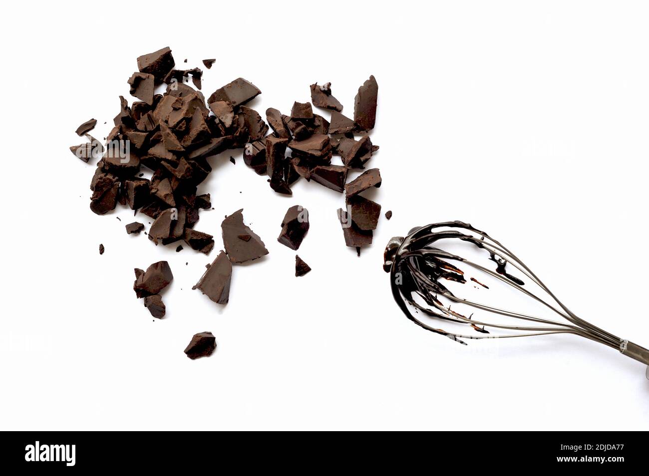 Broken Chocolates And Wire Whisk On White Background Stock Photo Alamy