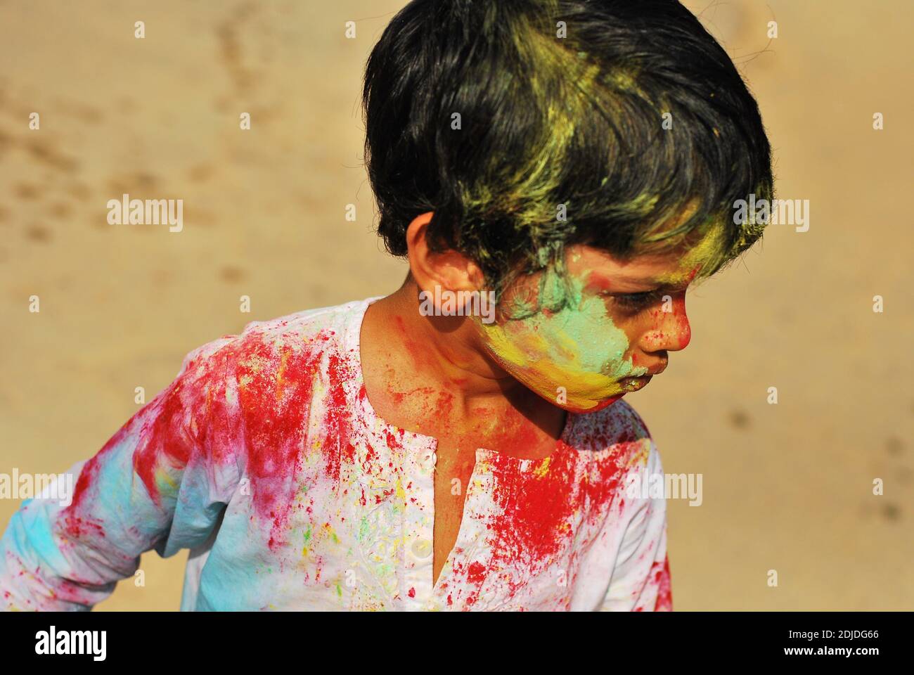 Colored boy celebration holi festival hires stock photography and