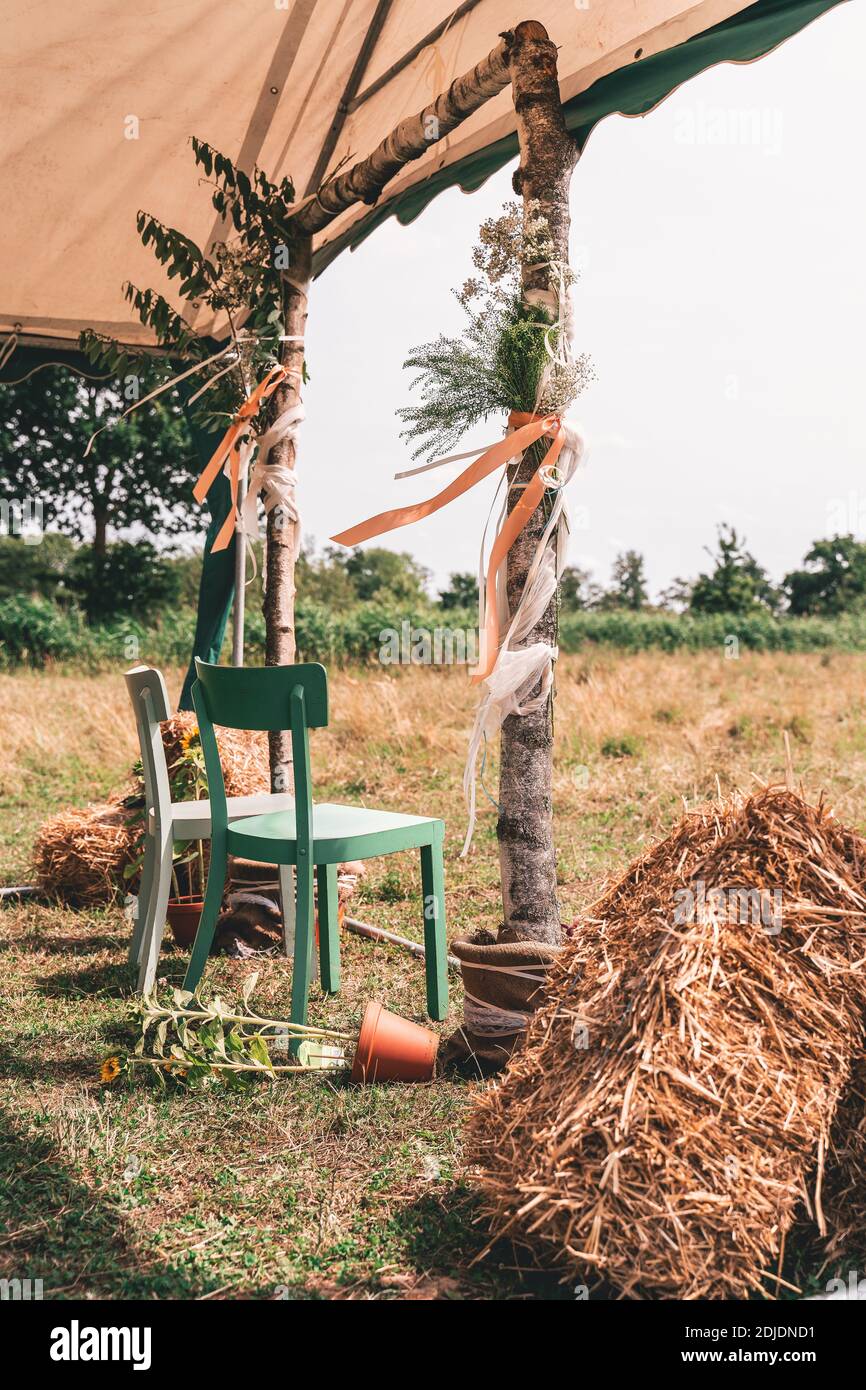 Beautiful Outdoor Wedding Altar Set Up With Chairs For Bride And Groom With Hay Bales And Sunflowers Stock Photo Alamy