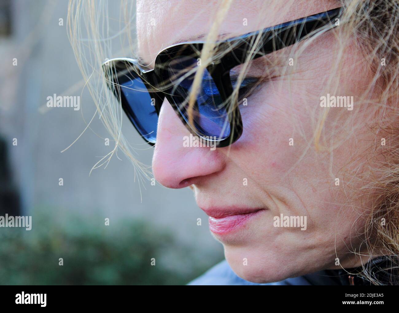 Close-up Of Woman Wearing Sunglasses Stock Photo